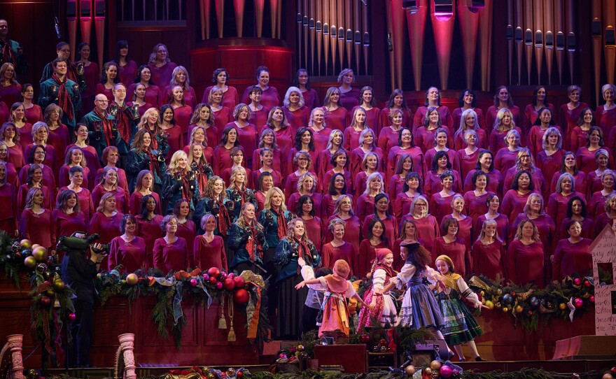 The Tabernacle Choir and Orchestra along with children dancing at Temple Square in "Season of Light: Christmas with The Tabernacle Choir"