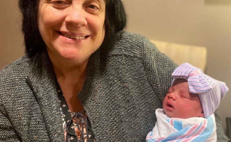 Rose Harrison holds her newest grandchild, her 10th, in January.