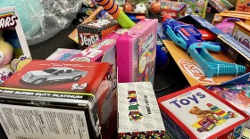 A smattering of toys is piled on the ground at Logan Heights Community Development Corporation, Dec. 2, 2025.