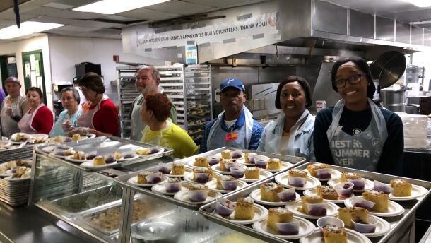 Volunteers prepare to serve food for the Christmas Eve lunch at Father Joe's Villages in downtown San Diego,  Dec. 24, 2019.