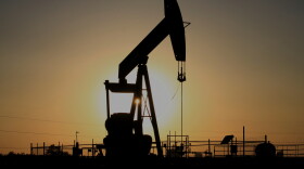 A pump jack operates at sunset in the Permian Basin near Loving, N.M., on Tuesday, May 20, 2025.