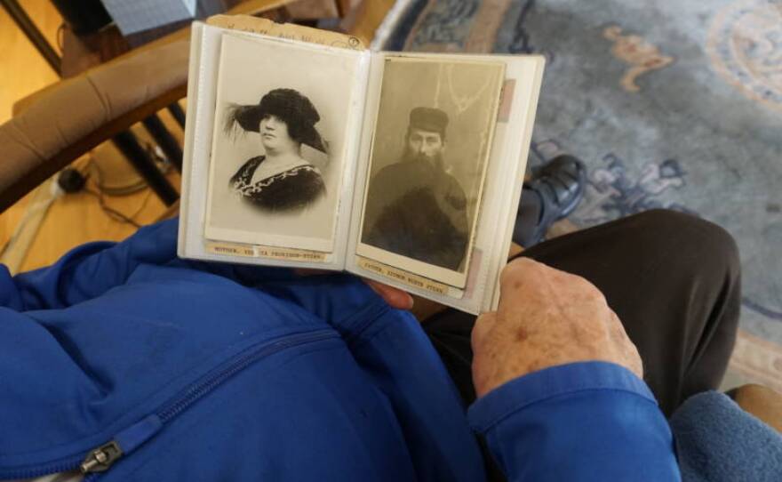 Ben Stern looks at some of the few surviving photos of his parents in this undated photo.
