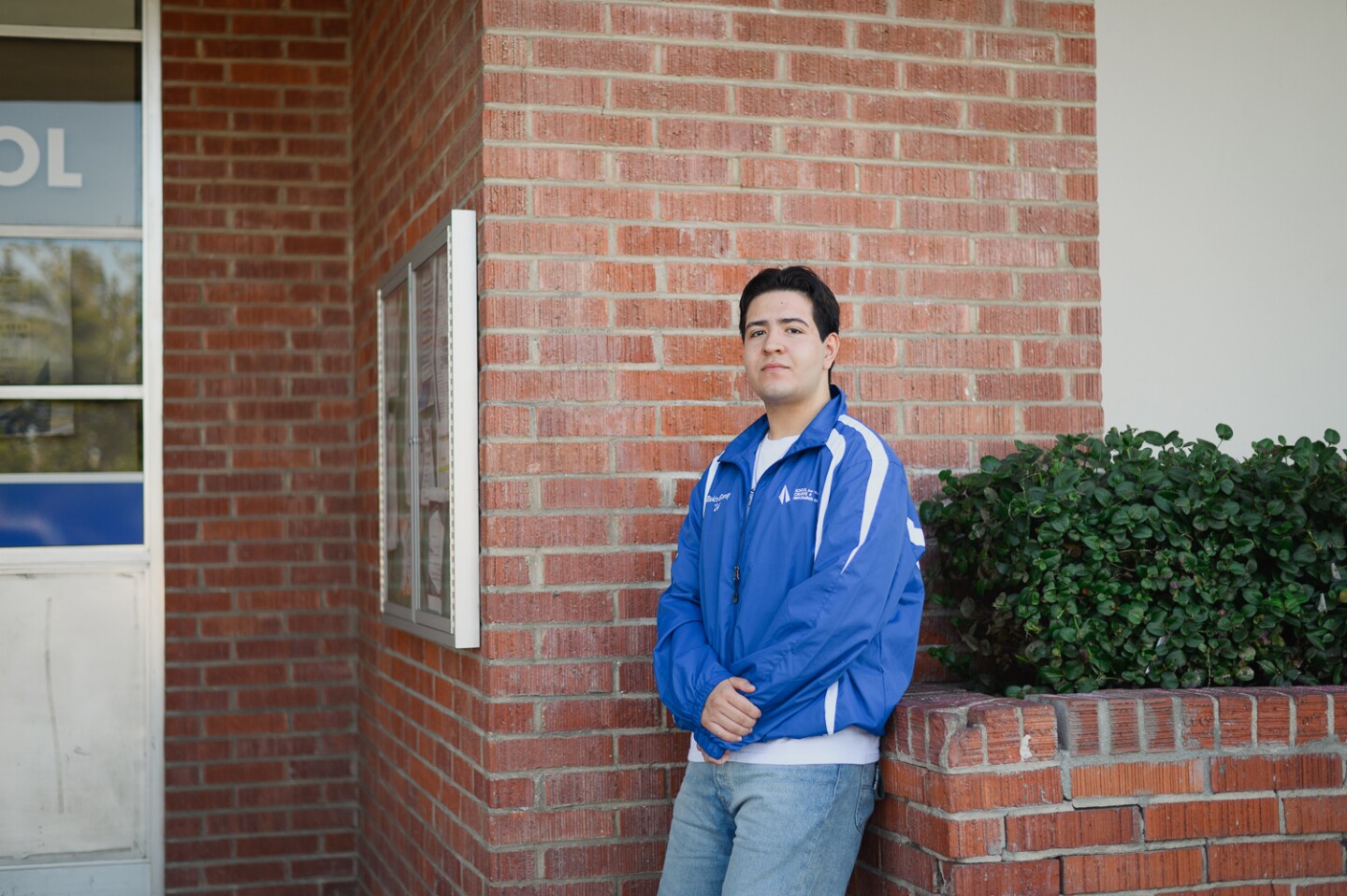 Chula Vista High student Kevin Gonzalez, a senior in the theater program, stands for a portrait outside the school on Jan. 30, 2024. Students say recent decisions by the district is placing the future of the school's arts program in jeopardy.