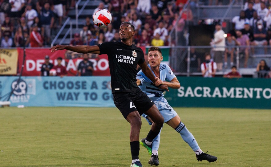 Sacramento Republic's Douglas Martinez Jr., left, and Sporting Kansas City's Rémi Walter battle for the ball during their U.S. Open semifinal game.