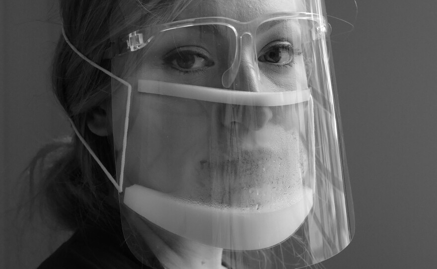 Speech therapist Peyton Wischmeier wears two clear masks in November 2020 so she can protect herself but the kids she works with can still see her mouth. In the beginning of the pandemic, some of her patients were afraid of her. Wischmeier is recently back from maternity leave and takes extra precautions so she does not bring COVID home to her newborn.