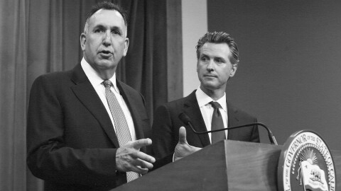 Steve Gordon, left, who was appointed by Gov. Gavin Newsom to head the California Department of Motor Vehicles, discusses a report detailing efforts by the DMV to improve customer services during a news conference in Sacramento, on July 23, 2019.