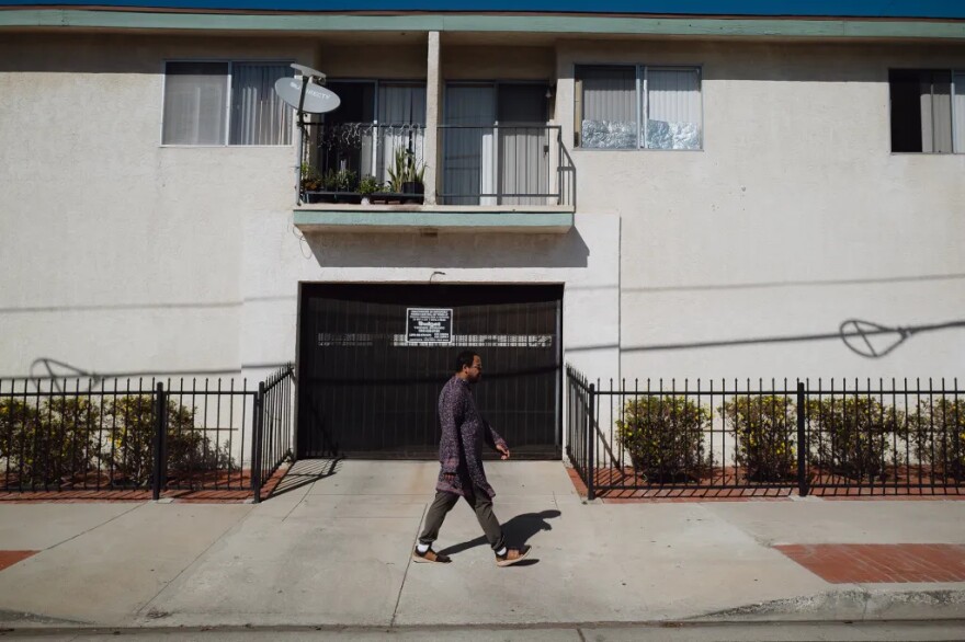 Will Rose takes a long walk around his neighborhood to support his mental health in San Pedro on Oct. 16, 2025. The 29-year-old has been struggling to find a sense of community, which has left him feeling lonely.