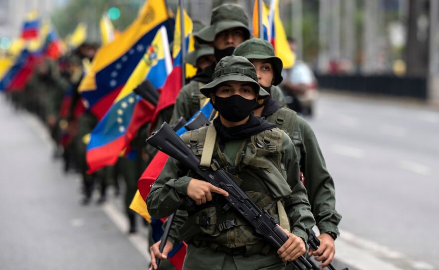 Venezuelan armed service members participate in a military parade in Caracas on March 5.
