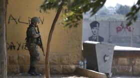 A Turkish soldier stands at the border with Syria in Akcakale, Sanliurfa province, southeastern Turkey, Thursday, Oct. 10, 2019.