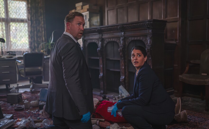 Shown L-R: DS Brendan Perry (Phill Langhorne), DS Tanika Malik (Natalie Dew) in MASTERPIECE: THE MARLOW MURDER CLUB, Season 2 Episode 1.