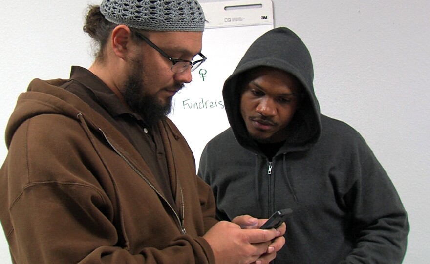 Khalid Alexander talks to Aaron Harvey at the Pillars of the Community office, Feb. 23, 2017.