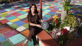 Amanda Moschella sits beside the garden she planted at Spanish Village Art Center in honor of her late dog, Shilo, on Sept. 14, 2026.