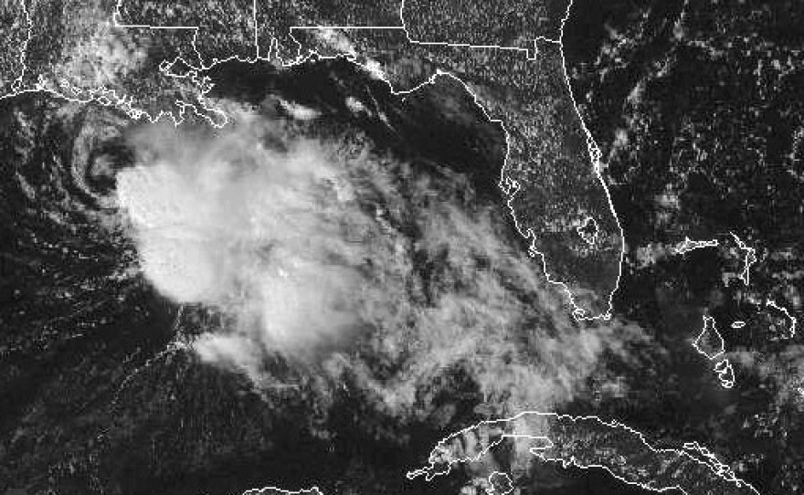 A GOES satellite handout photo provided by the National Oceanic and Atmospheric Administration shows Tropical Storm Karen churning in the Gulf of Mexico Saturday afternoon. Karen, the second named storm to hit the U.S. this hurricane season, has weakened into a tropical depression.