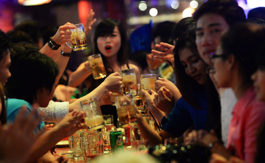 Alcohol consumption is low in Asia — but it definitely happens. Above: Vietnamese imbibe at a open-air beer bar in Ho Chi Minh City.