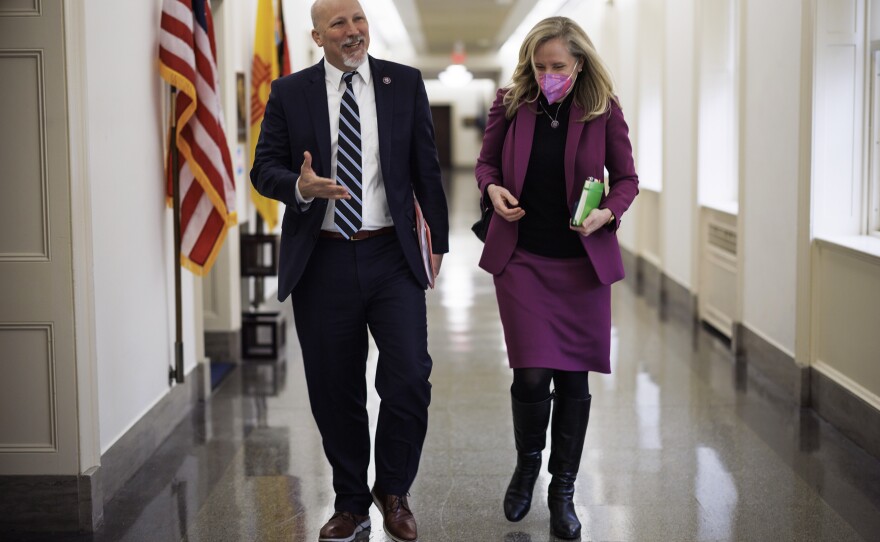 Rep. Roy and Rep. Spanberger chat while walking though the Longworth House office building on Capitol Hill.