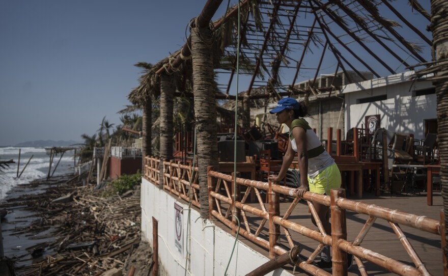 <strong>Oct. 29:</strong> A woman stands at a damaged area in the aftermath of Hurricane Otis in Acapulco, Mexico.