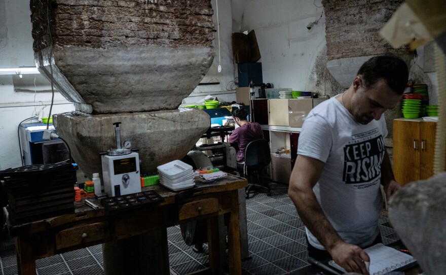 A former cistern built in the 6th century is now used as a jewelry workshop, where artisans work amid Byzantine-era columns.