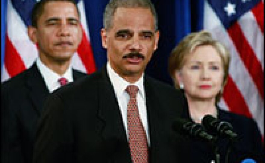 Attorney general nominee Eric Holder speaks as President-elect Barack Obama and Sen. Hillary Clinton (D-NY) stand by at a news conference Dec. 1 in Chicago.