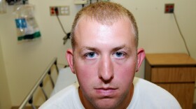 Ferguson police officer Darren Wilson during his medical examination after he fatally shot Michael Brown, in Ferguson, Mo., 2014.