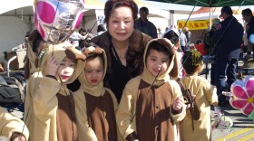 Pinki Chen poses with a group of children dressed up for the year of the dog
celebration at the Alhambra Chinese New Year festival in this undated photo. 