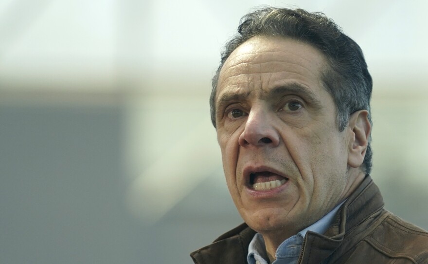 New York Gov. Andrew Cuomo speaks to people at a vaccination site earlier this month in New York.