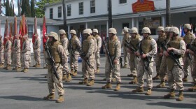 First Marine Division Color Guard lines up before their historic headquarters building on Camp Pendleton before the March-off Ceremony.