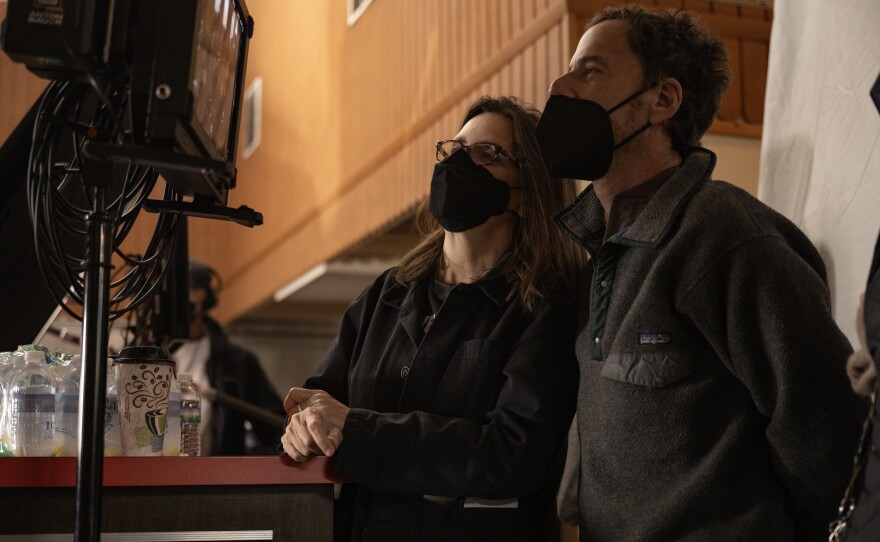 Writer/producer Tricia Cooke (left) and director/writer/producer Ethan Coen (right) on the set of "Drive-Away Dolls." (2024)