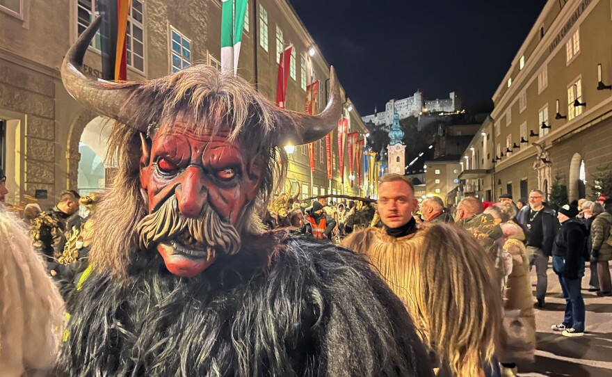 After a city bus drops off more than 200 Krampuses at the entrance to the old town of Salzburg, the Krampuses start to put their masks on and get into character.
