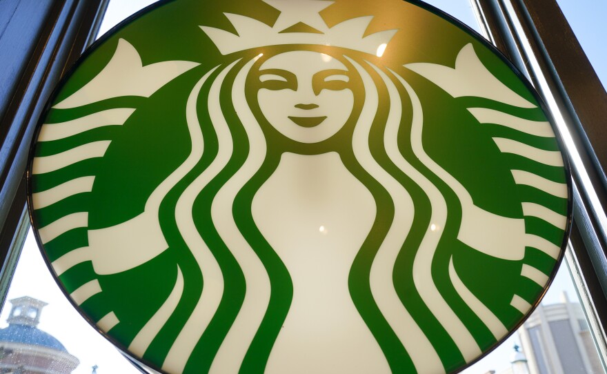 There are now nearly 33,000 Starbucks locations around the world. Here, a Starbucks logo hangs in the window in Homestead, Pa.