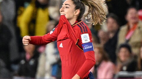 Spain's Olga Carmona points to the message she had written on her undershirt to honor the death of one of her best friend's mother after scoring what would be the only goal in the match against England on Sunday. Carmona later learned that her father had died before the final match.
