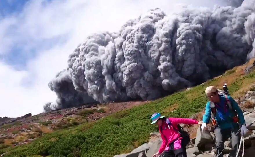 A hiker's dramatic video captured the scene as a huge cloud of ash poured down the side of Mt. Ontake in Japan Saturday.