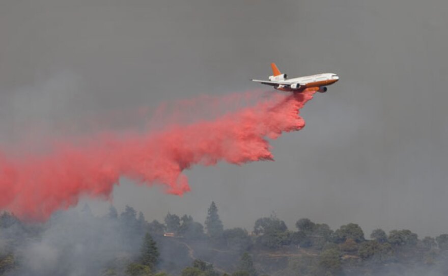 An air tanker drops a load of fire retardant over Henry Coe State Park, Morgan Hill, California.