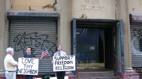 Supporters of Park51, the proposed Islamic community center, stand outside the former Burlington Coat Factory store where the project is slated to be built. The site has become a small tourist attraction and regularly sparks impromptu debates on the street.