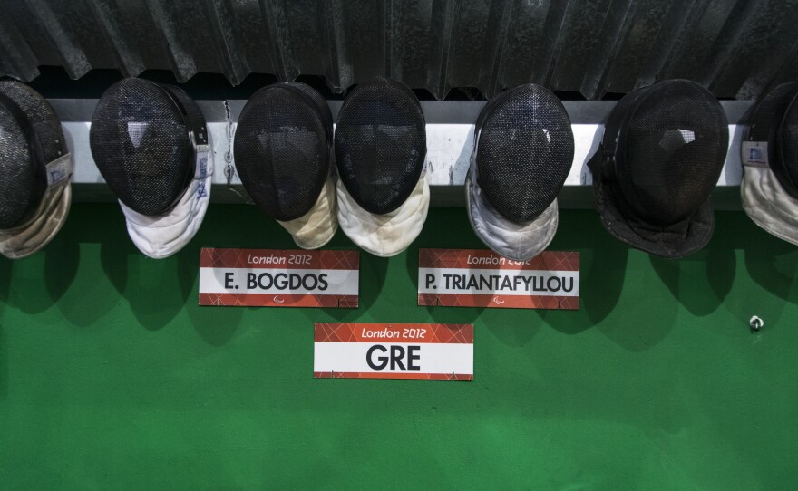 Fencing masks on the wall of the court where Greece's national wheelchair fencing team is training.