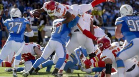 Kansas City Chiefs running back Charcandrick West, top, is kept out of the end zone by San Diego Chargers linebacker Joe Mays during the first half of an NFL football game Sunday, Nov. 22, 2015, in San Diego.