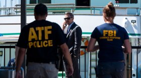 In this Sept. 8, 2019 file photo, investigators check the Truth Aquatics office on the Santa Barbara Harbor in Santa Barbara, Calif. 