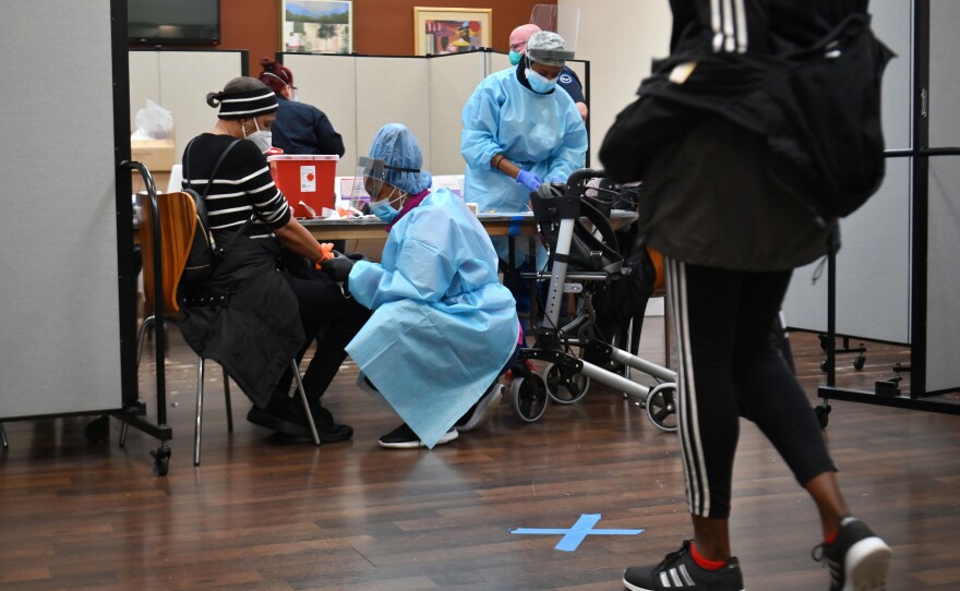 A registered nurse draws blood to test for COVID-19 antibodies at Abyssinian Baptist Church in the Harlem neighborhood of New York City on May 14. Churches in low income communities across New York are offering COVID-19 testing to residents.