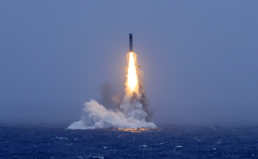 In this photo released by Xinhua News Agency, a long-range ballistic missile bursts out of the sea during a test launched from a Chinese nuclear-powered submarines in the South Pacific on Monday.