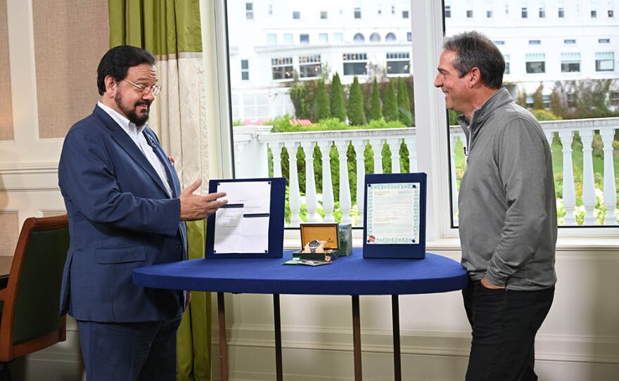 Peter Planes (left) appraises a 1994 Rolex Zenith Patrizzi dial Daytona watch, in Bretton Woods, N.H. 