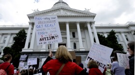 Protesters against a measure requiring California schoolchildren to get vaccinated are pictured rallying outside the Capitol in Sacramento, April 8, 2015. 