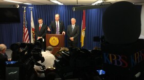 Mayor Kevin Faulconer talks to reporters about the next move in city negotiations with the San Diego Chargers after the NFL rejected the team's proposal to move to Carson, Jan. 13, 2016. Also shown are county Supervisor Ron Roberts, right, and City Attorney Jan Goldsmith.
