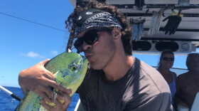 In this photo taken July, 2018, Keolu Fo reeled in a big one of the coast of Molokai, Hawaii. 