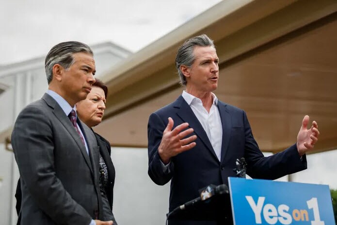 From right, Gov. Gavin Newsom, along with former Senate President Pro Tem Toni Atkins, and Attorney General Rob Bonta, speaks in support of Prop. 1 during a press conference at the United Domestic Workers of America building in San Diego on Feb. 29, 2024.