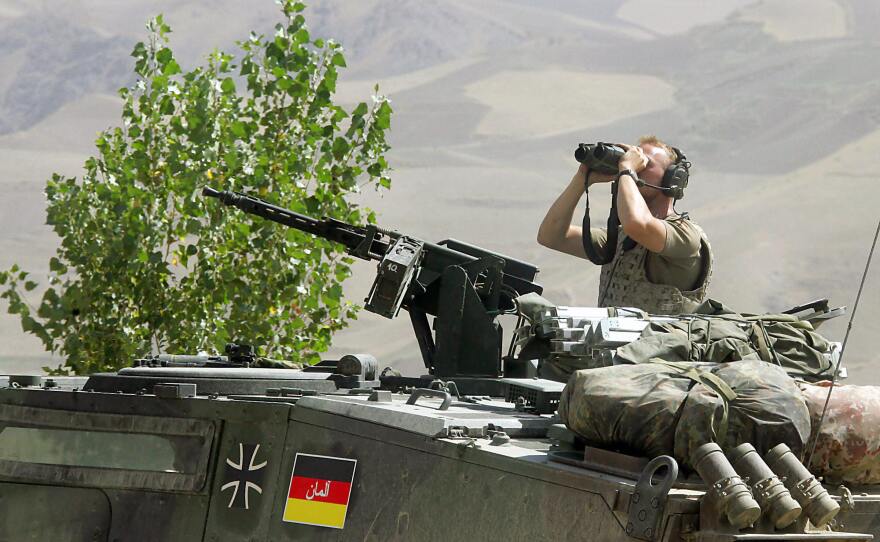 A German soldier observes the area at the airport of Faizabad, northern Afghanistan in 2006. Germany contributed thousands of troops to NATO forces in Afghanistan.