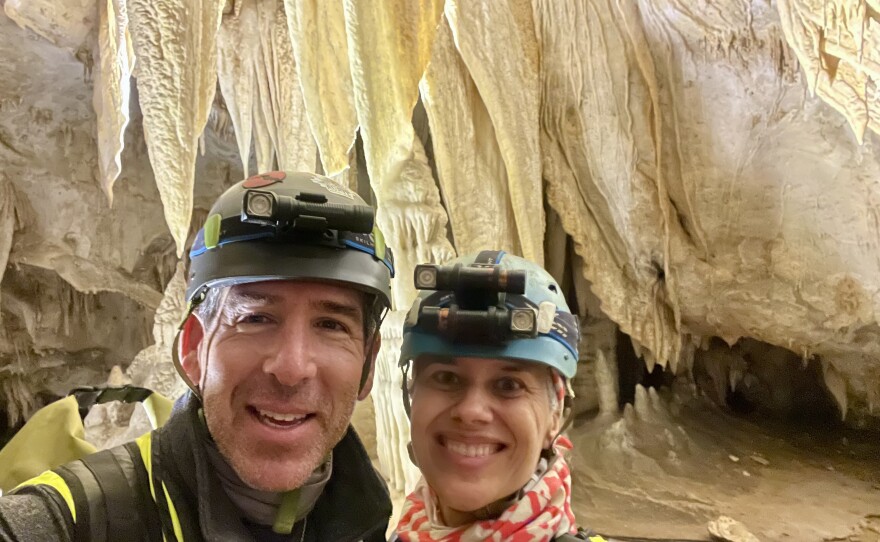 Katheryn Jager and Garrett Smith, pictured inside Honey Creek Cave in Texas in 2023. Jager says the two bonded over their love of outdoor adventures and will go caving immediately after their leap day wedding.