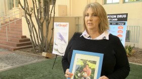 Susan Foster Nussbaum holds a photograph of her son, Gabriel, who died of a prescription drug overdose in 2011, shown on Oct. 20, 2016. 