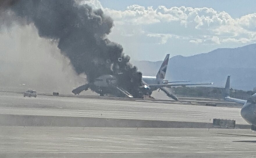 Smoke billows from a British Airways jetliner that caught fire at McCarren International Airport in Las Vegas Tuesday. The pilot of the craft is due to retire next week.