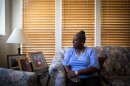 Anita Fisher looks towards a photo of her son at her home in Spring Valley, Aug. 16, 2022.