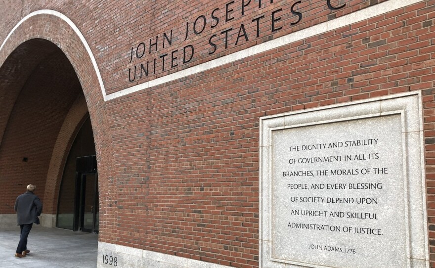 Etchings on the federal courthouse in Boston acclaim a well-administered justice system, but many working in the building say that is getting harder, given the continuing federal shutdown.