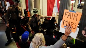 State troopers remove people from the Tennessee House gallery on Thursday during a special session of the state legislature to redraw congressional voting maps.